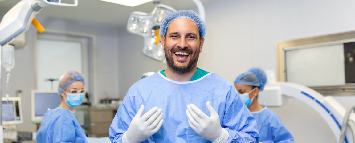 Medical professional smiling in surgical setting